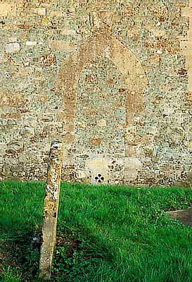 ENG: South West Region, Wiltshire, North Wessex Downs AONB, The Vale of Pewsey, The Altons, Alton Priors. Medieval chapel; detail of wall and grave [Ask for #198.032.]