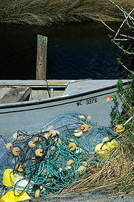 NC: Hyde County, Hatteras National Seashore, Ocracoke Island, Ocracoke Island Marshes, on Pamlico Sound, Fishing boat & nets on Parkers Creek, a short inlet to Pamlico Sound [Ask for #224.443.]